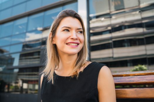 Business woman standing outdoors.